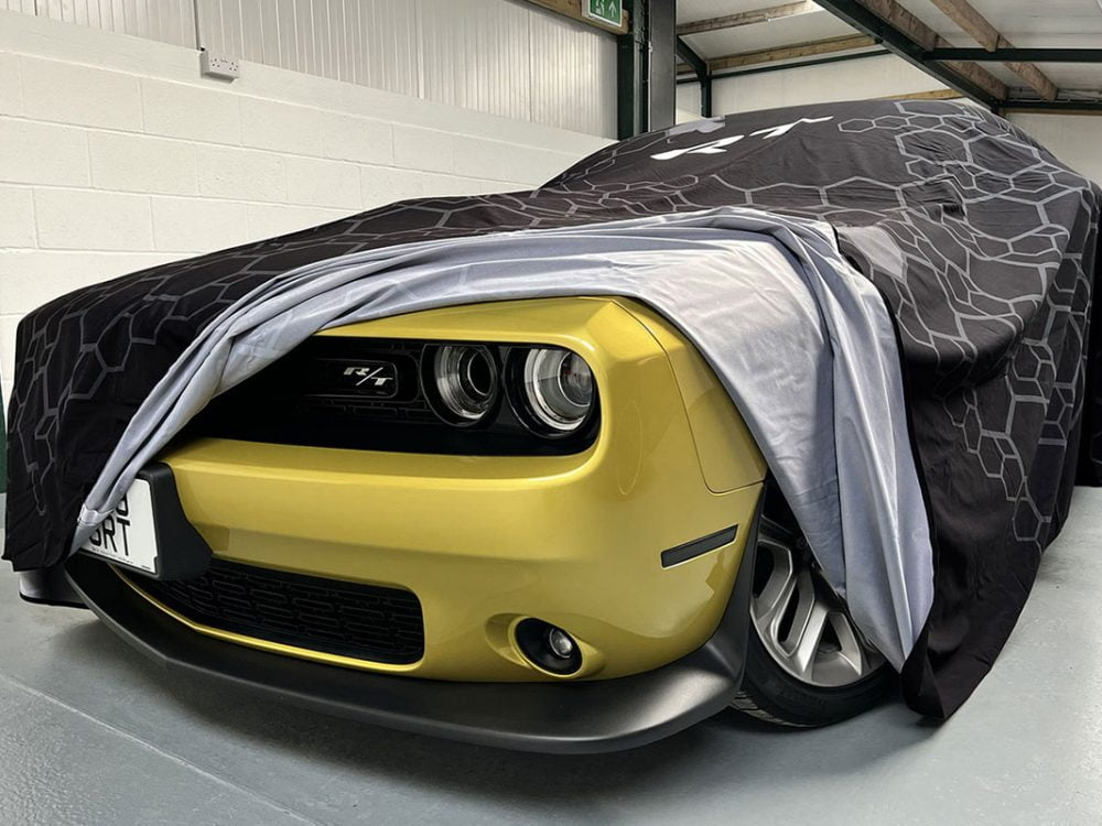 Close up of Car Reveal Cover over Dodge Challenger